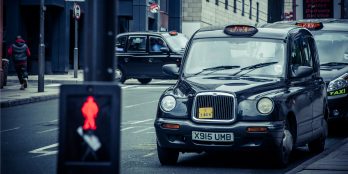 a-line-of-black-cab-taxis-at-a-taxi-rank