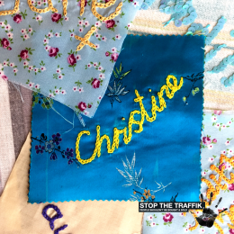 a-square-of-fabric-with-the-name-christine-stitched-in-the-middle